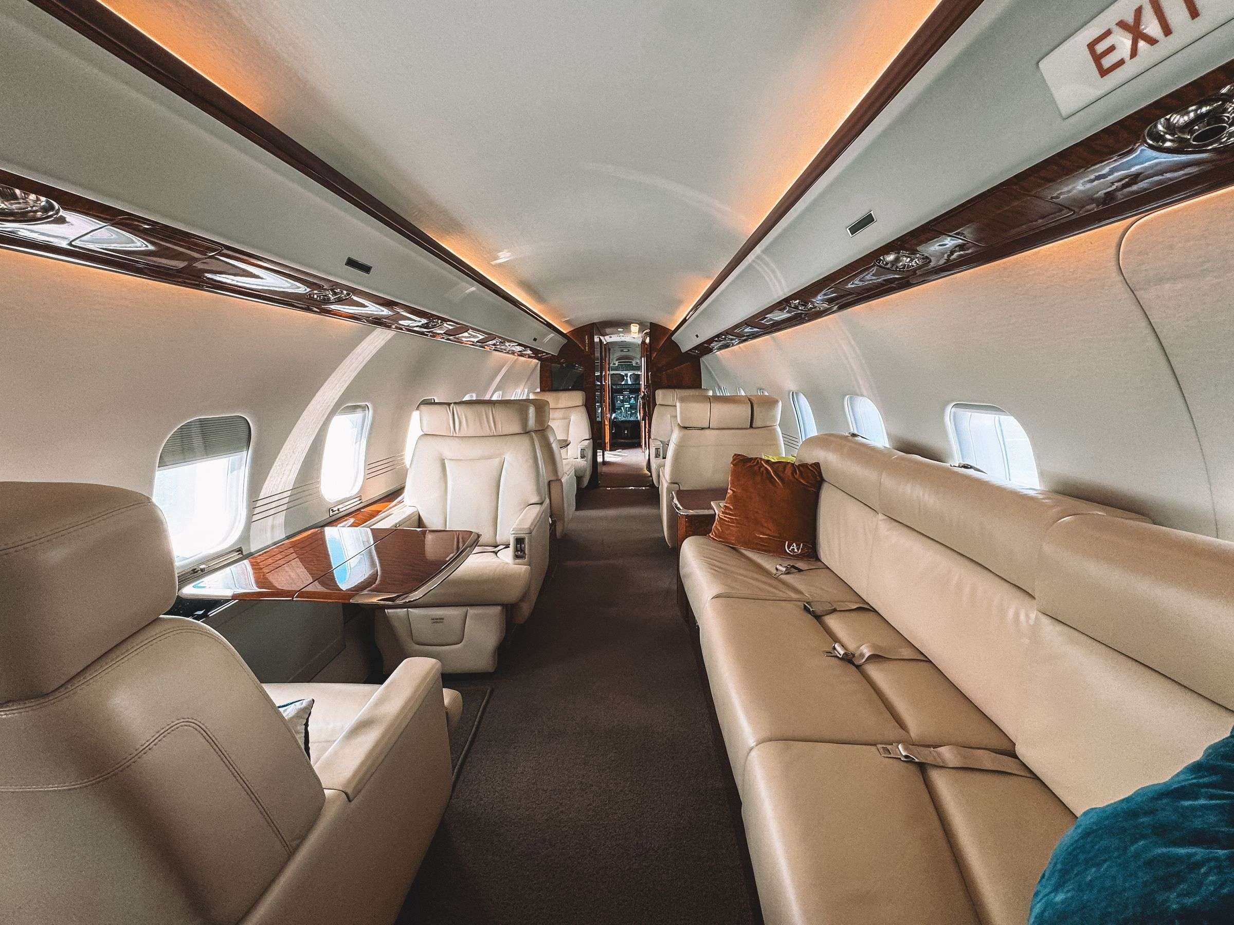 Interior of a private jet cabin with leather club seats