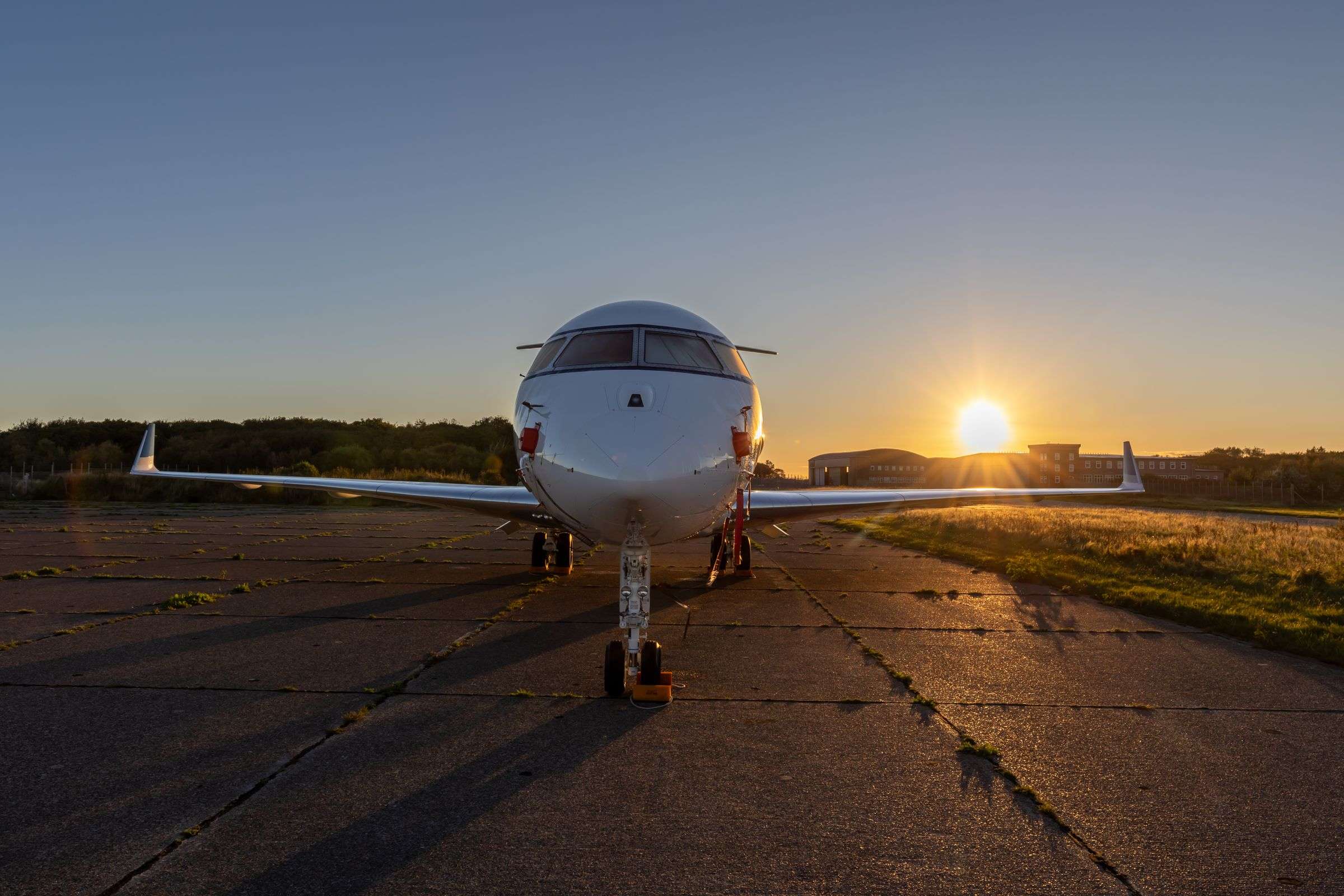 Private jet waiting on the tarmac at golden hour